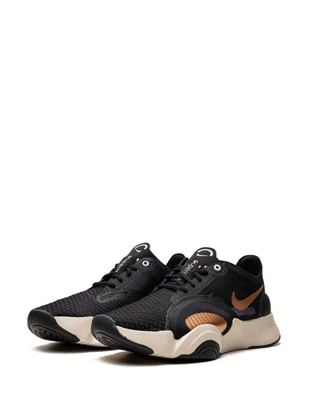Black low-top training shoe with tan Swoosh, laces, and supportive midsole