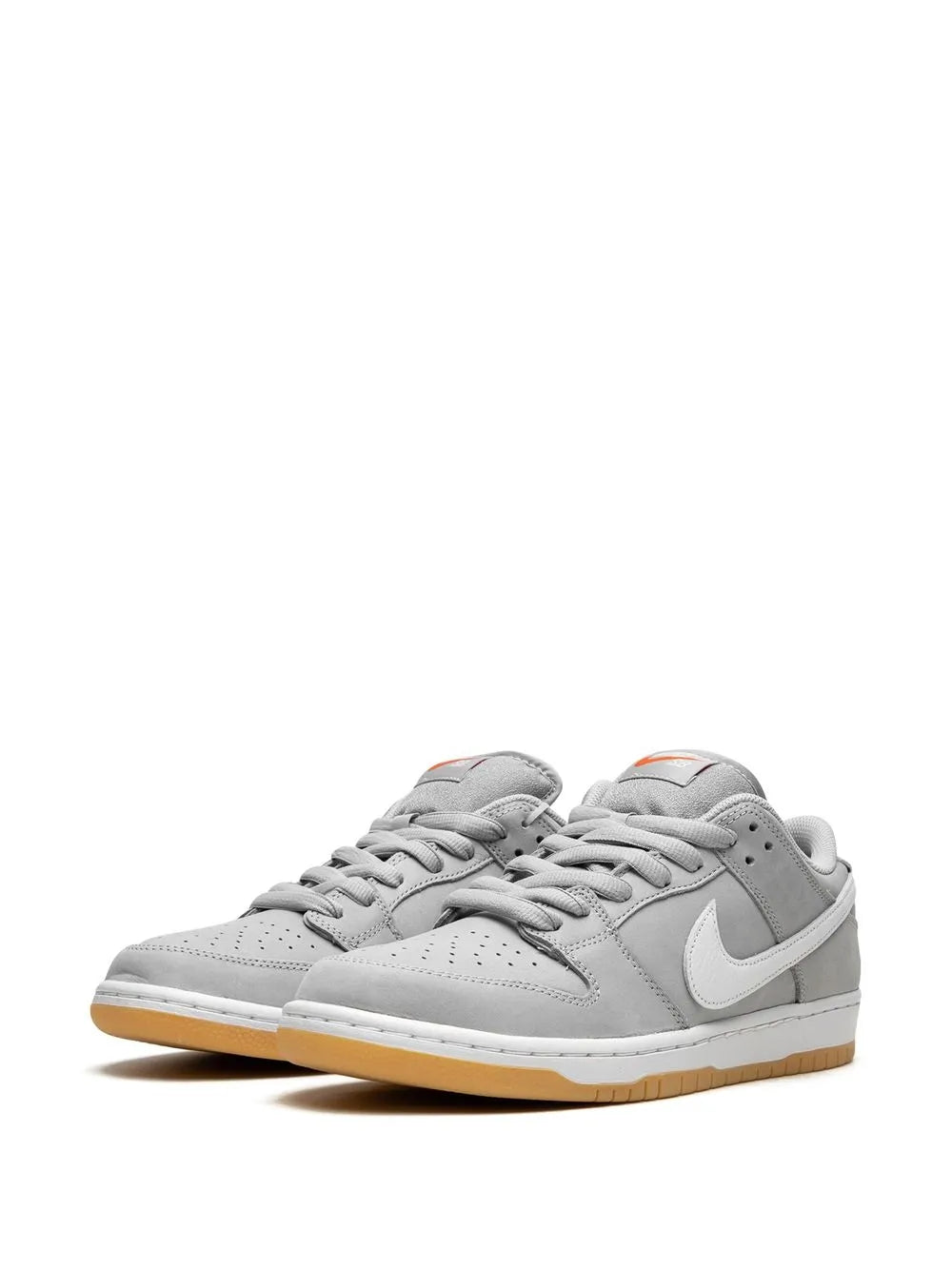 Nike SB Dunk Low Pro ISO low-top sneakers, light gray uppers, white Swoosh, gum sole.