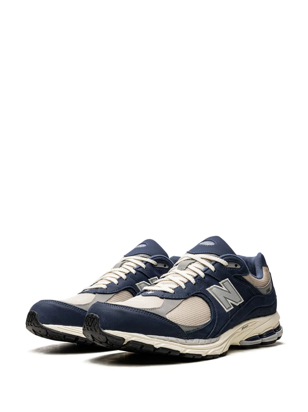 Low-top sneaker in navy and off-white with lace-up front and N logo