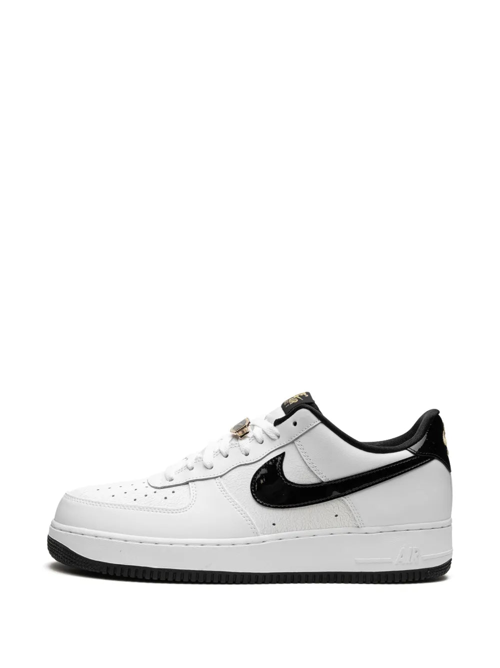 White Nike Air Force 1 sneakers with black swoosh, lace-up, dark sole