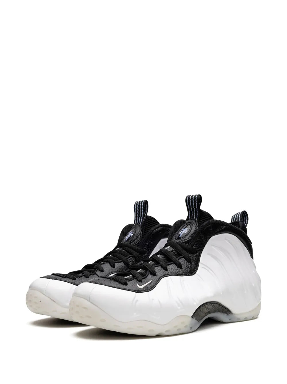 Black and white lace-up basketball sneakers with foamposite-style shell and chunky sole