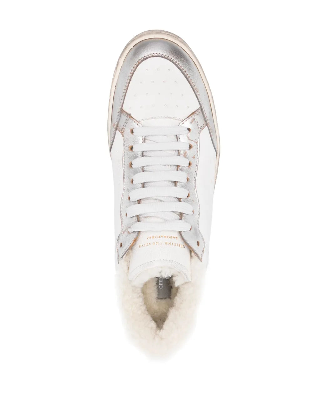 White lace-up sneaker top view with fur-lined interior and perforated leather upper