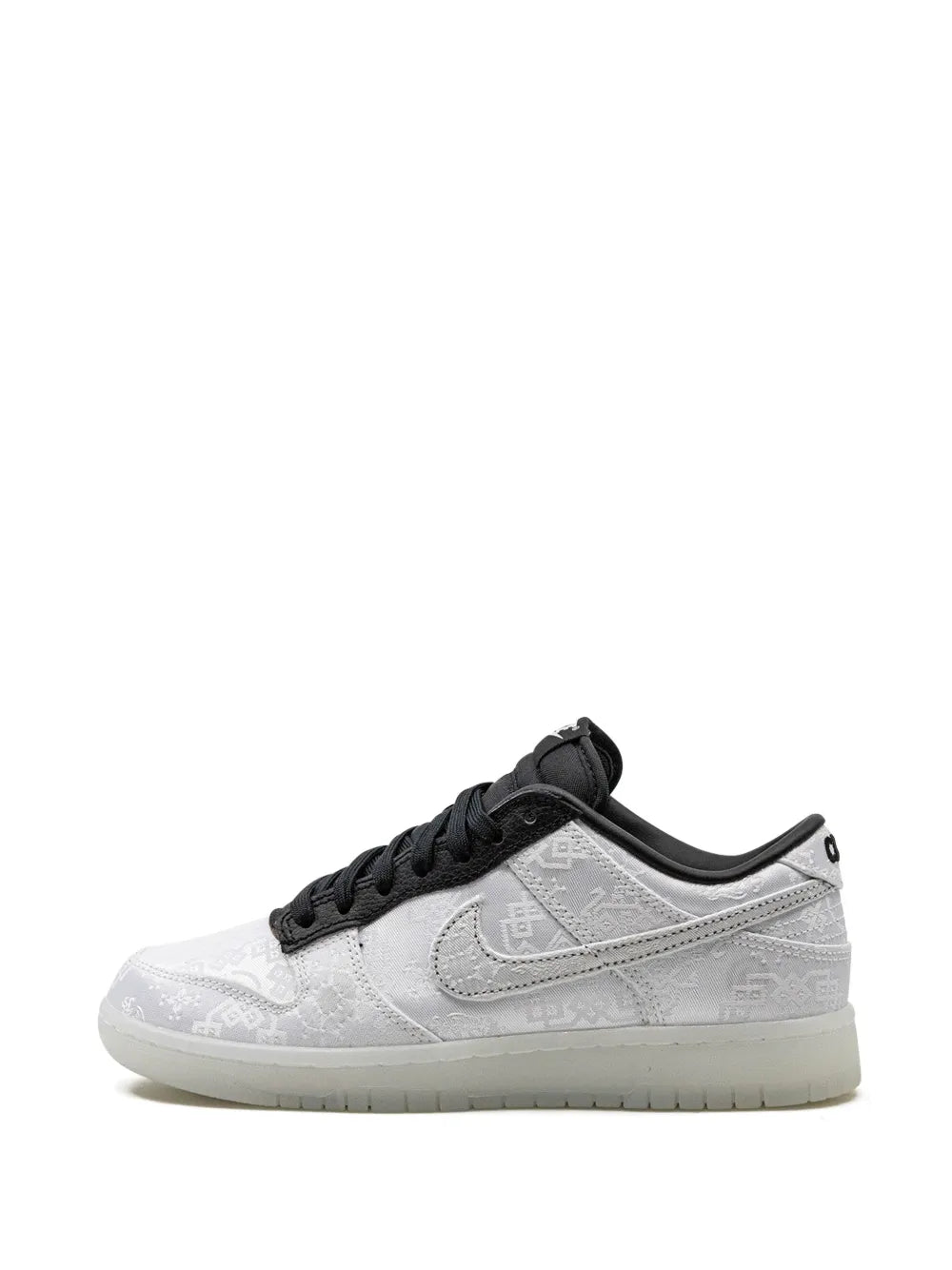 Low-top sneakers side view, light gray/white upper with black swoosh and laces