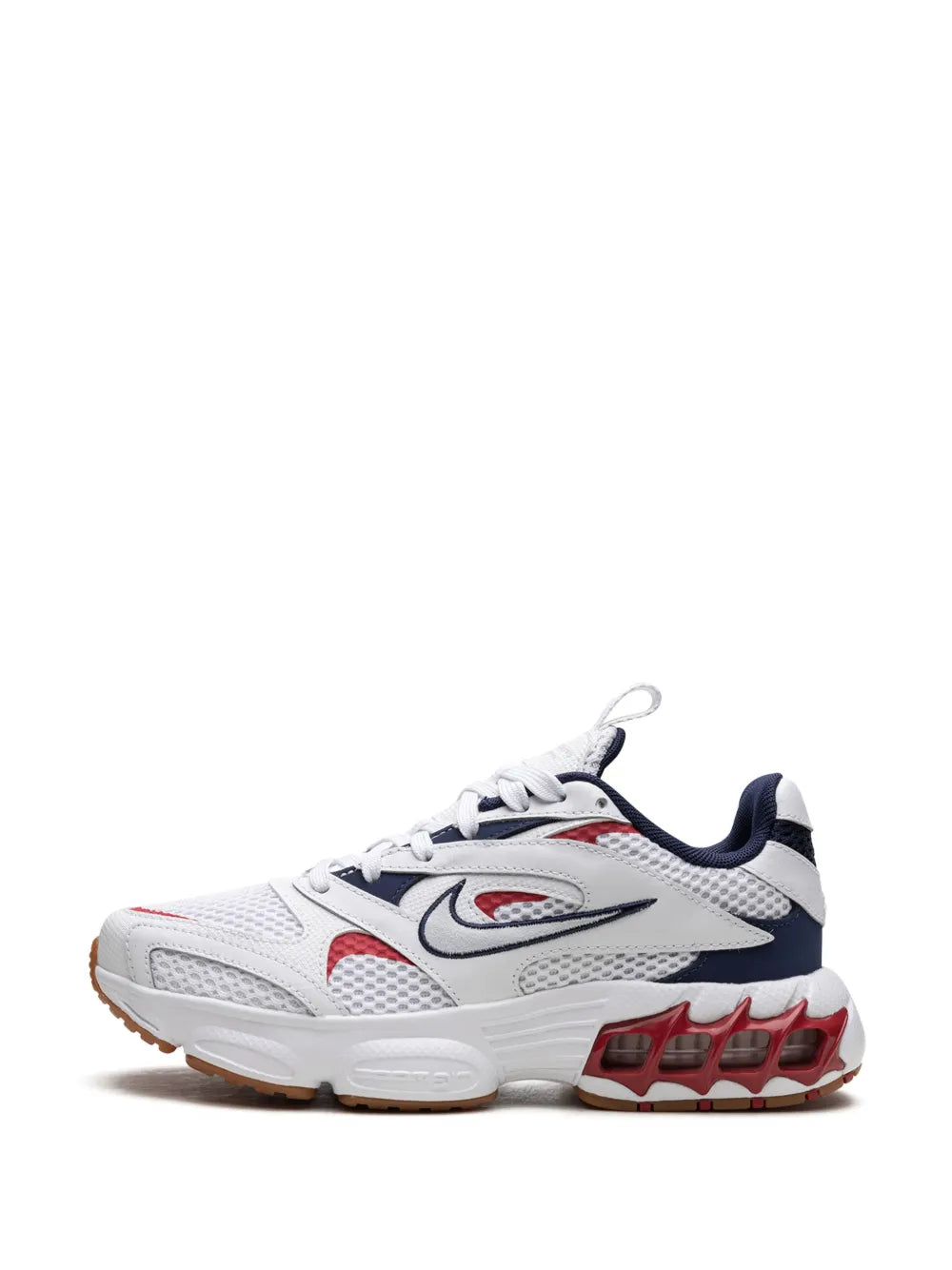 White sneakers with navy swoosh, red accents and chunky Air-style sole