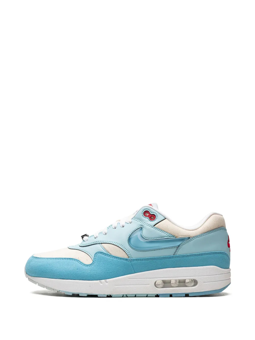 Nike light blue and white sneakers with swoosh and lace-up design