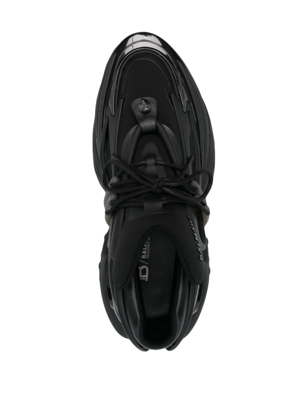 Balmain black low-top sneaker top view with lace-up eyelets and glossy toe panel