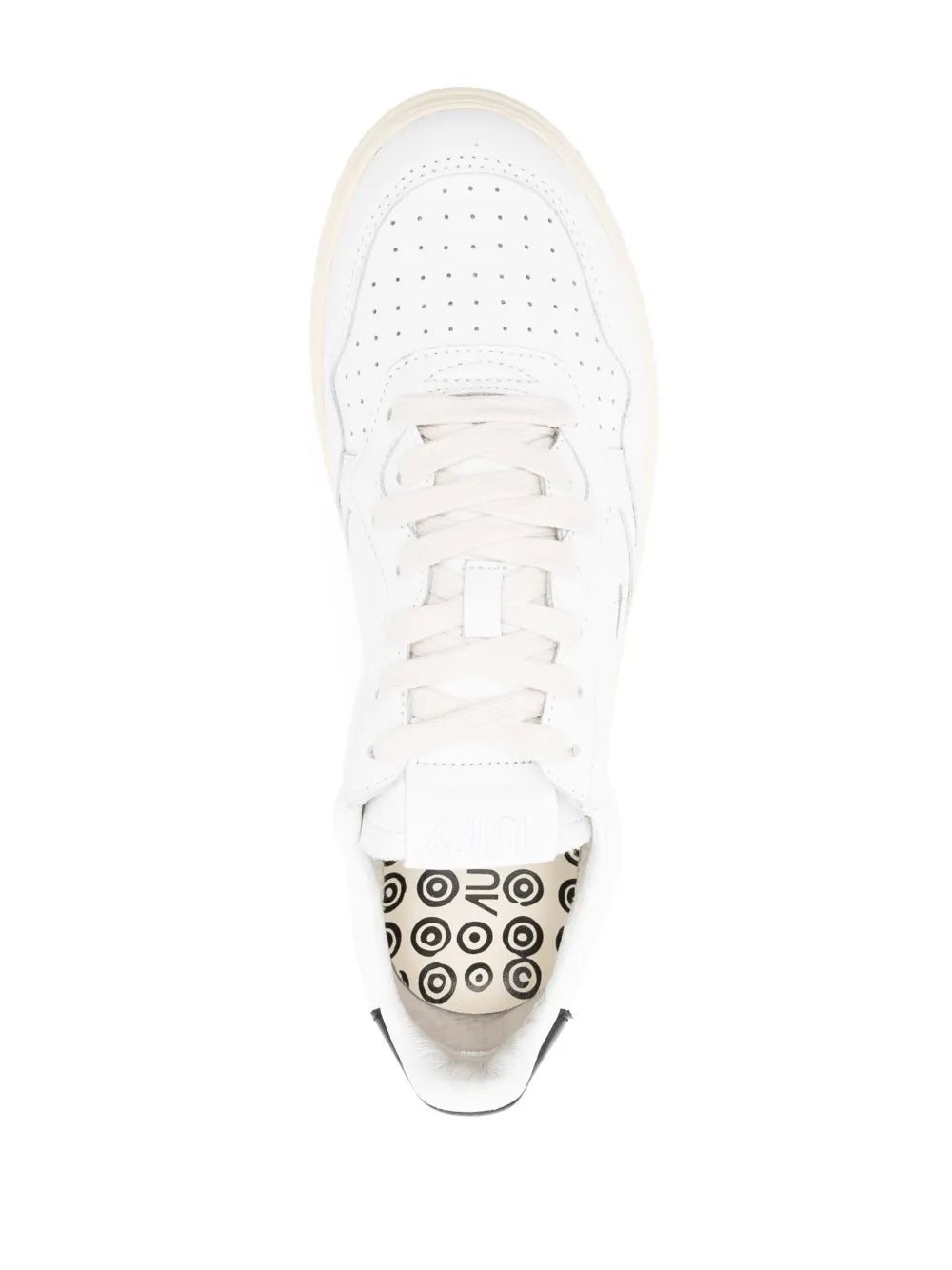 White lace-up low-top sneakers toe view with perforated toe box and cream sole