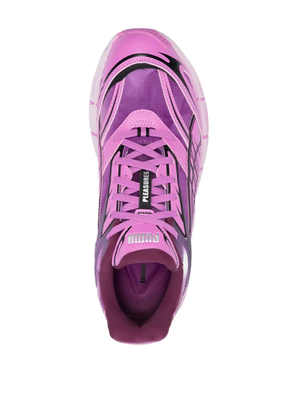 Pink low-top sneakers with lace-up vamp and PUMA logo on heel counter