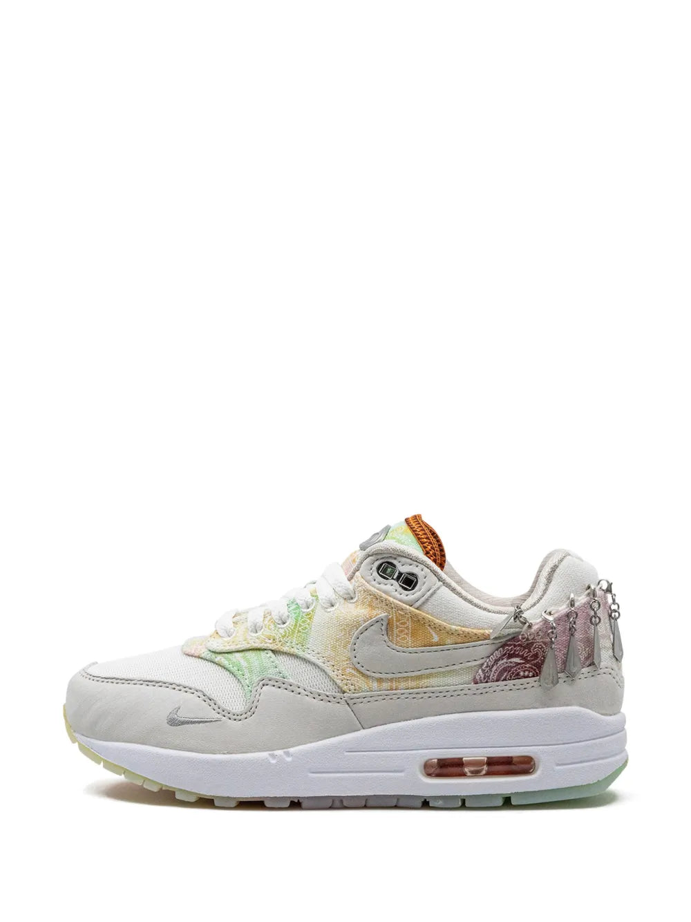 Nike Air Max 1 low-top with white uppers, green trim, and orange-brown heel detail