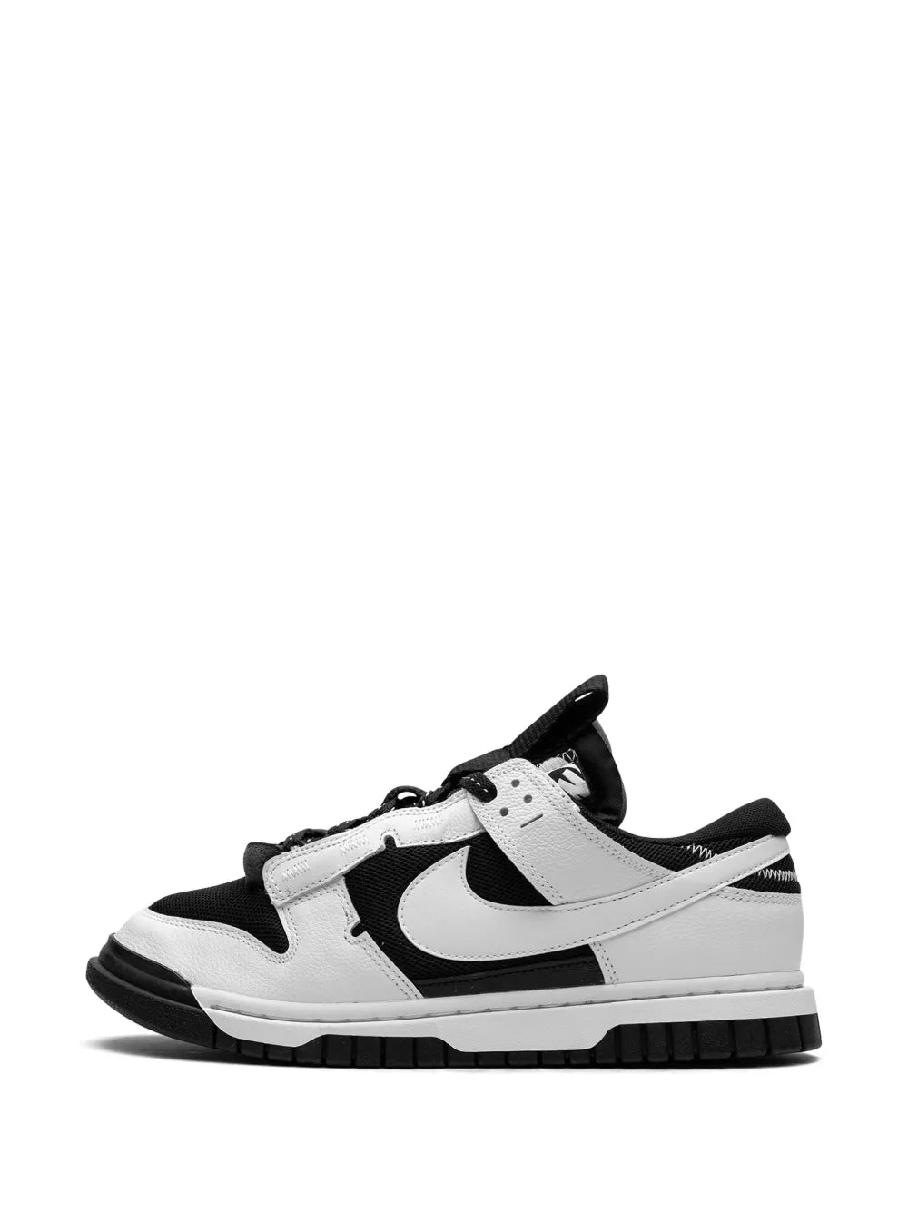 Nike Air Dunk Low sneakers, side view in black and white with Swoosh accents