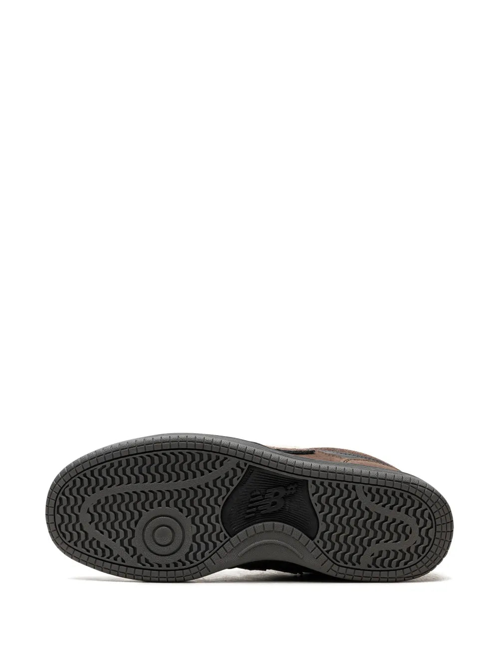 New Balance 480 sneaker outsole with textured tread on dark rubber sole.