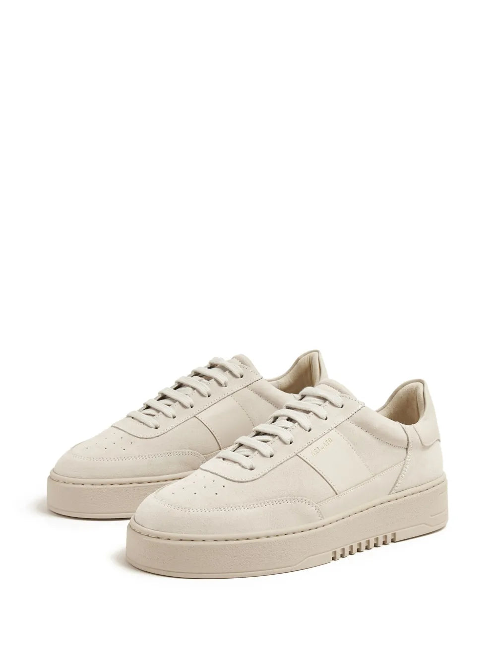 Pair of light beige low-top lace-up sneakers with matching rubber outsole