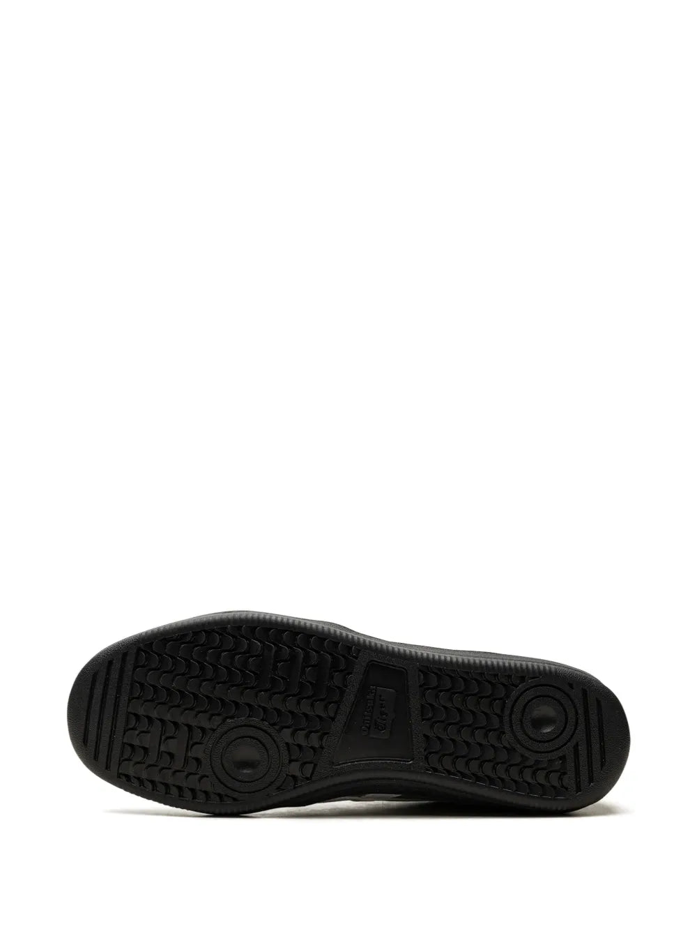 Black rubber outsole with textured tread and circular traction pods