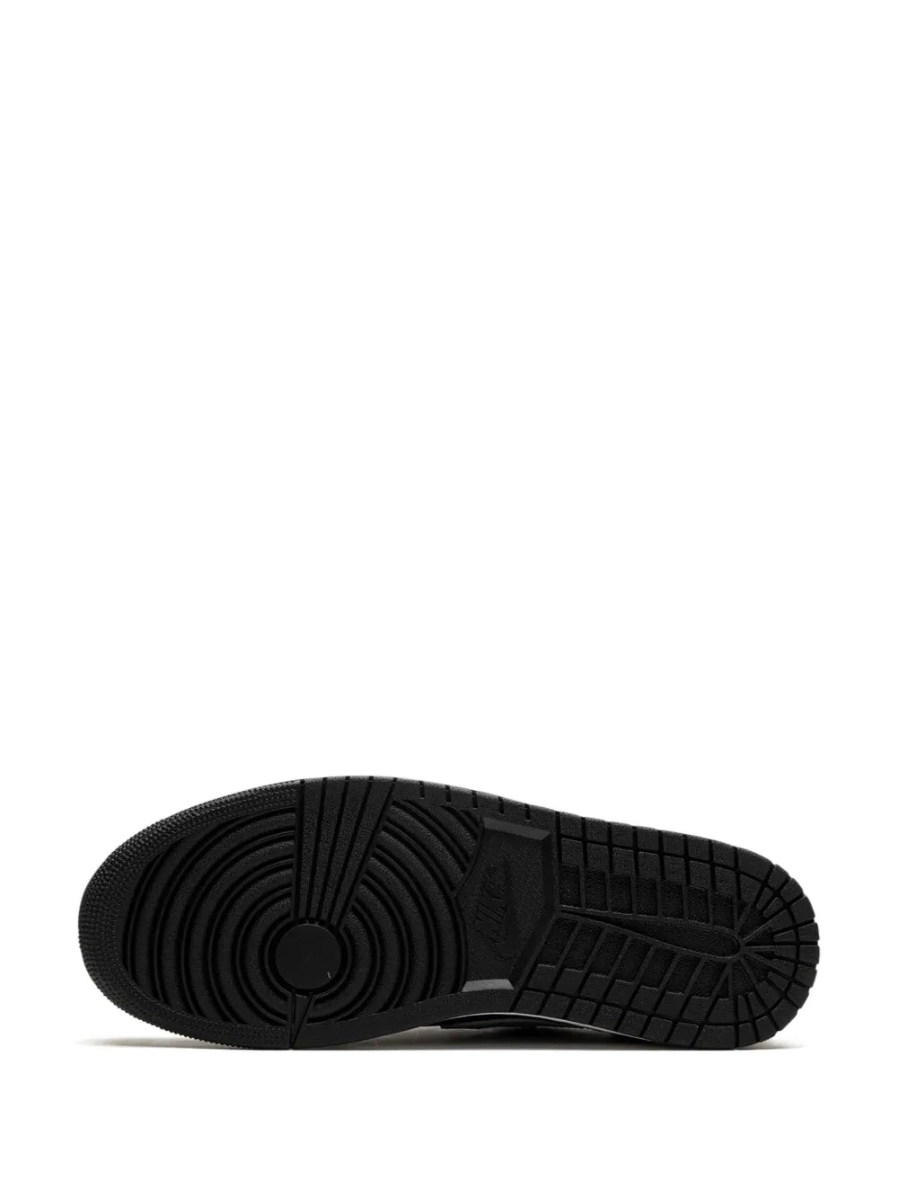 Black rubber outsole with deep tread and circular traction logo