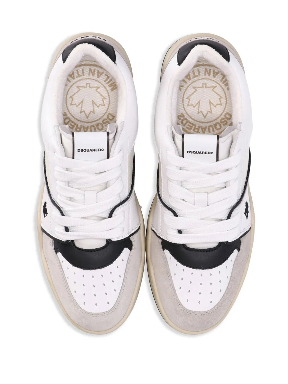 Pair of white-and-beige sneakers with insoles featuring circular logo and lace-up design.