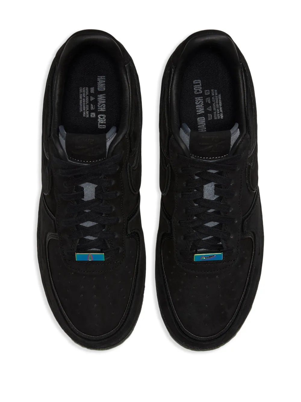 Pair of black Nike low-top sneakers, lace-up with padded tongue and blue accents