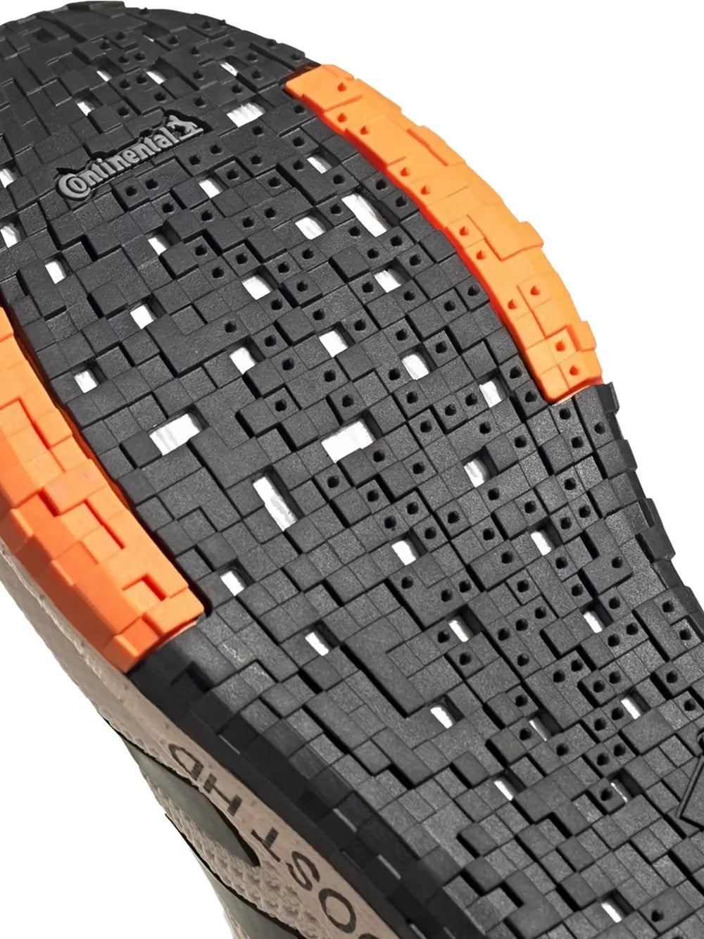 Black outsole tread with orange edge inserts and Continental branding