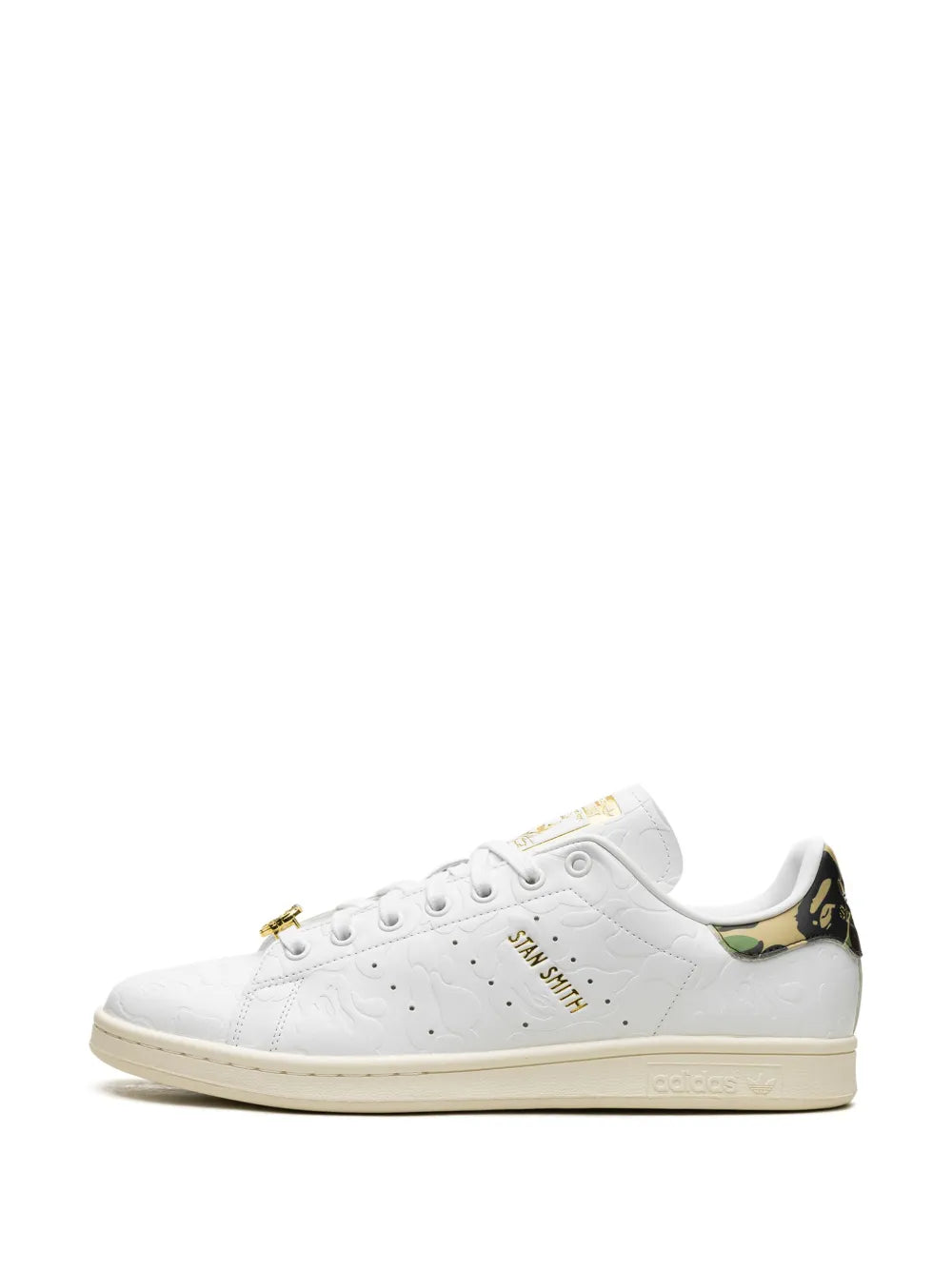 White adidas Stan Smith sneakers with gold lace eyelets and camo heel