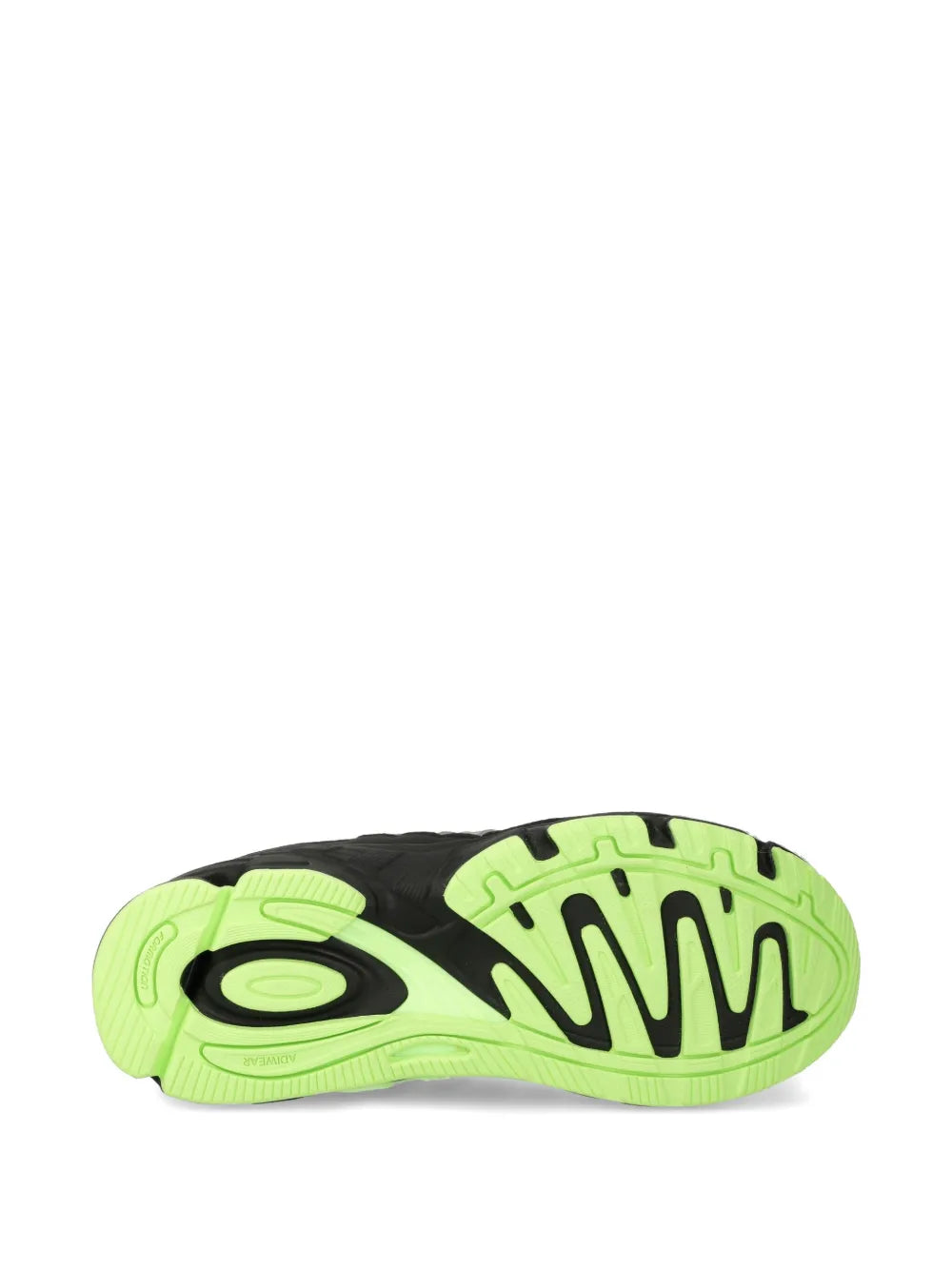 Neon green and black sneaker outsole with visible tread pattern
