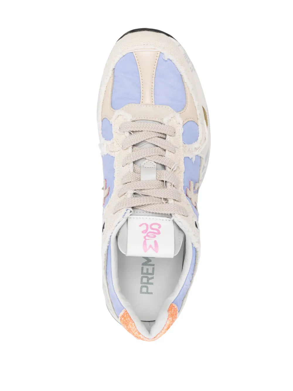 Beige lace-up sneaker front with light blue panels and printed tongue label