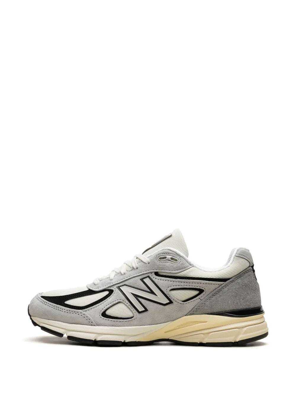 New Balance 990V4 sneaker with white upper, gray panels, black N logo, cream sole