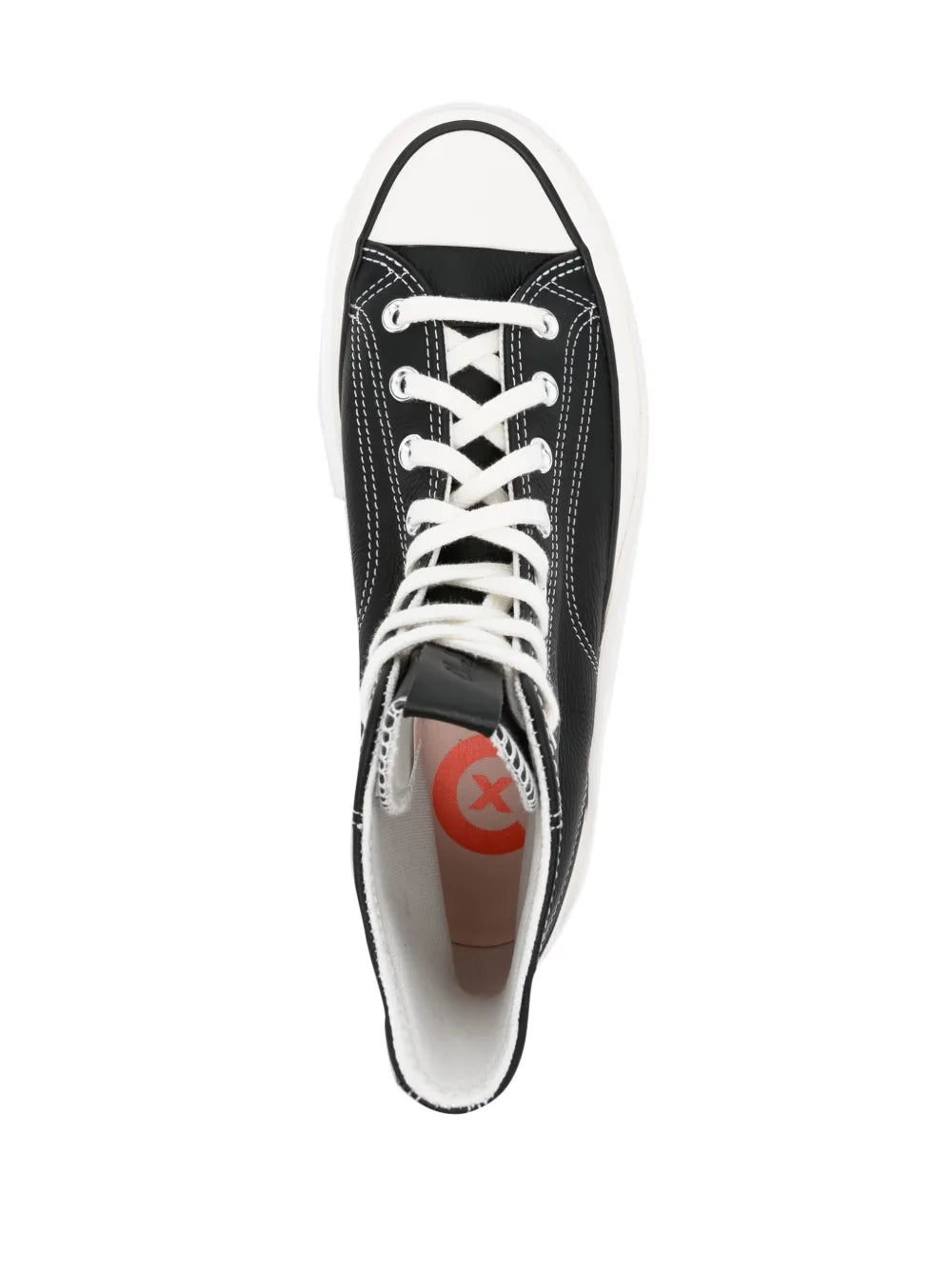 Black high-top sneaker showing interior lining and orange tongue label