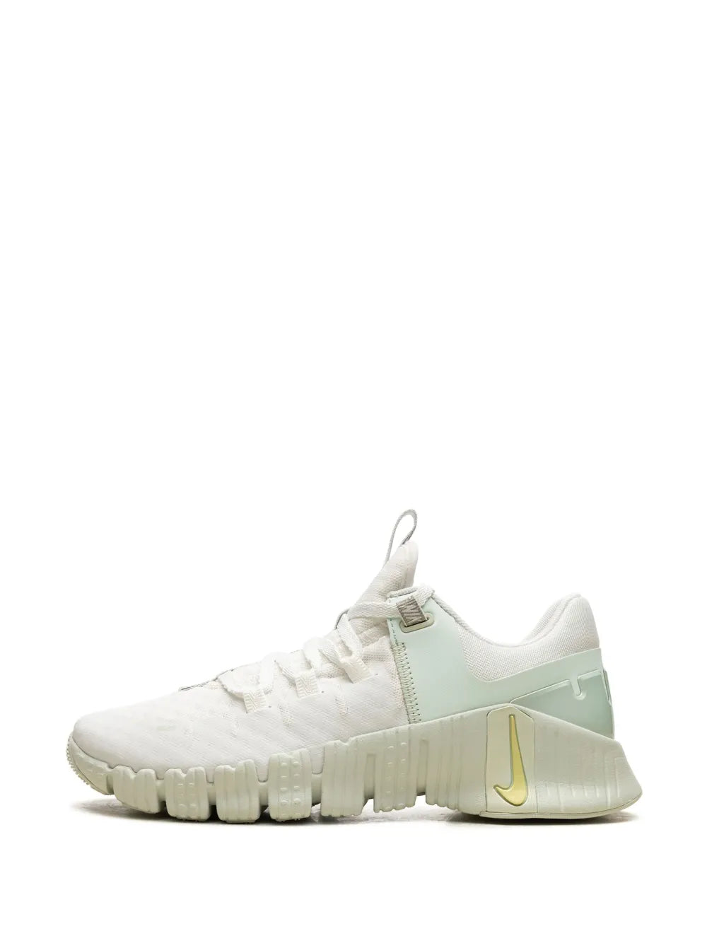 Nike white training sneaker with mint panel and yellow swoosh on heel