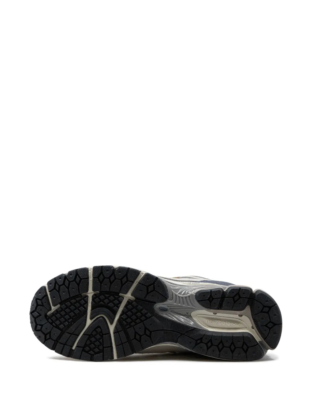 New Balance 1906F outsole view of light grey linen sneakers with tread pattern