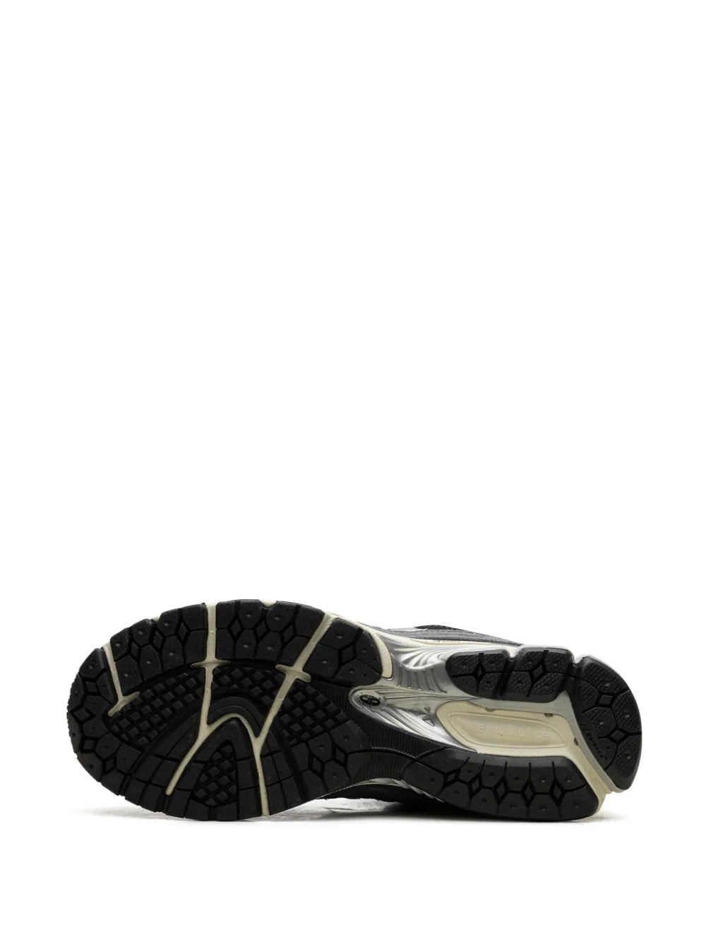 Suede running sneaker outsole view with black tread and beige midsole