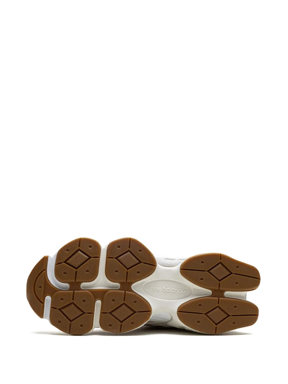 White sneaker outsole with brown hex tread pattern, underside view