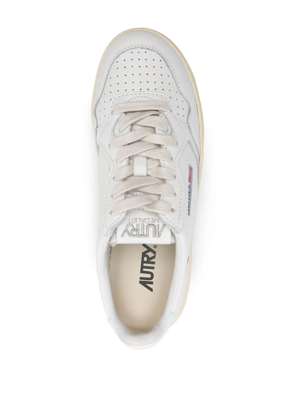 White leather platform sneaker front, lace-up with Autry logo tongue label
