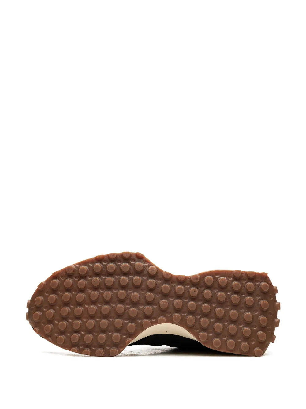 Low-top sneakers outsole underside with brown gum rubber tread