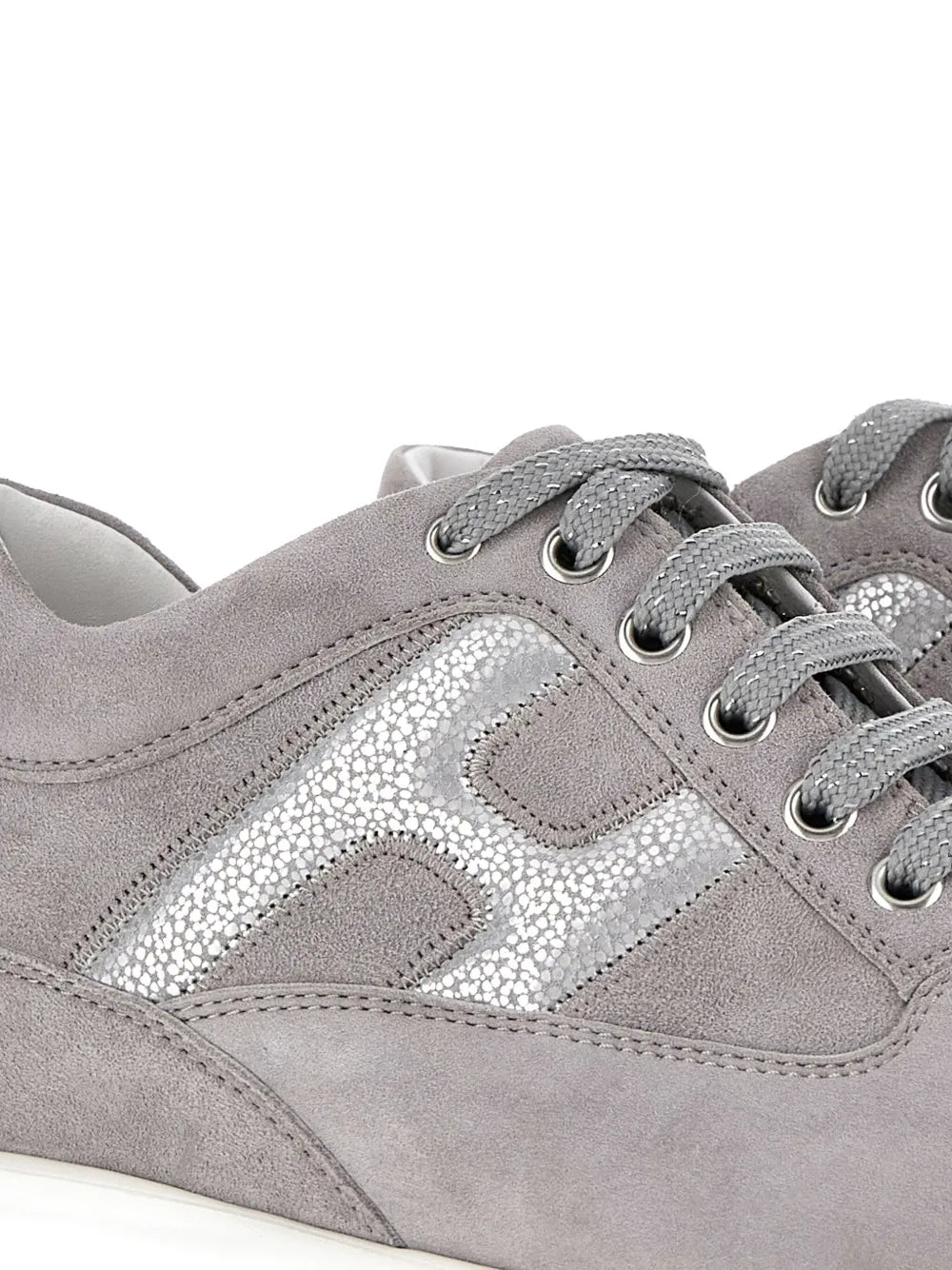 Grey suede Hogan low-top sneaker detail, silver-speckled side panel, lace-up.