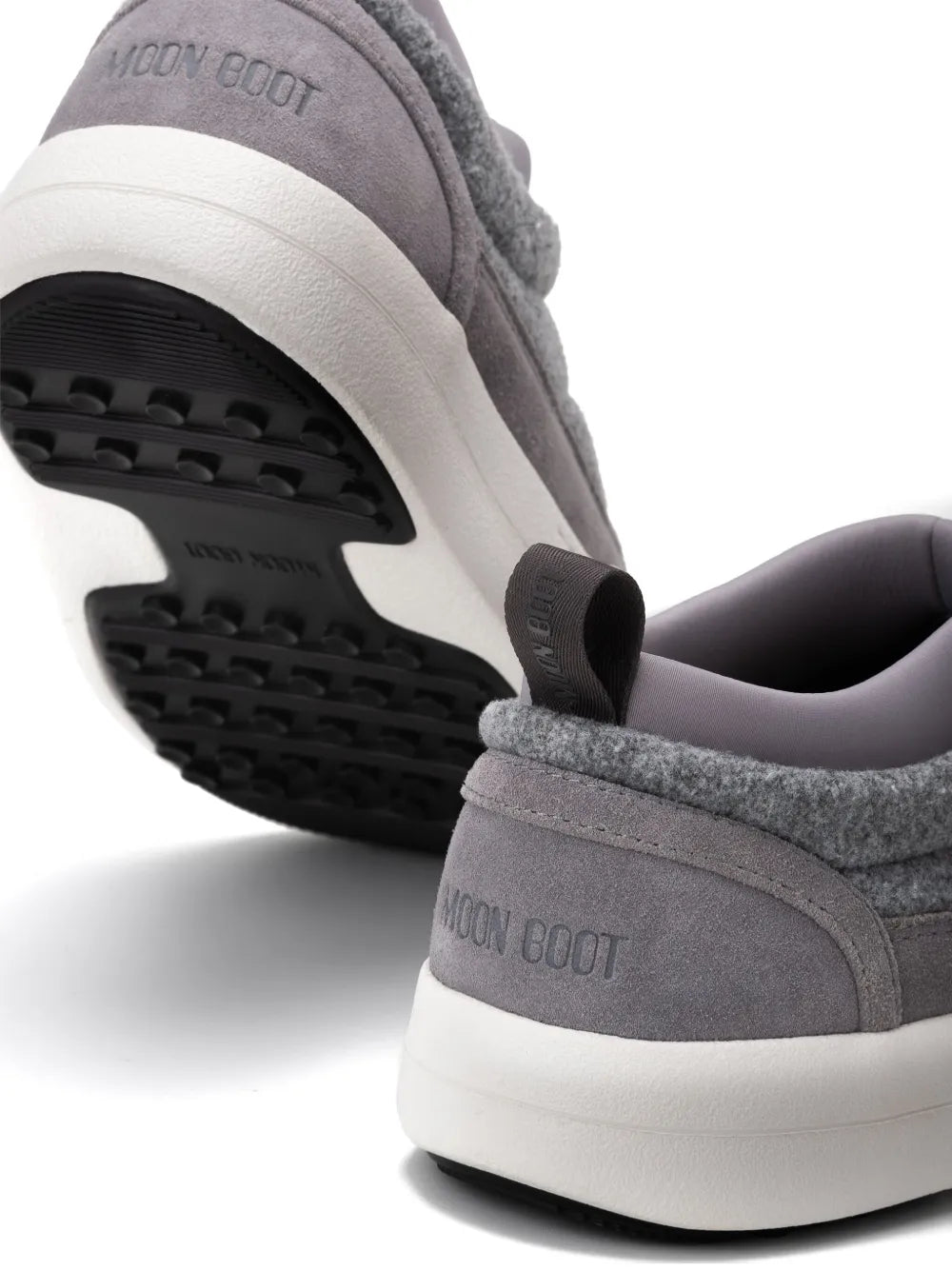 Ash grey sneakers with treaded black outsole and MOON BOOT heel logo