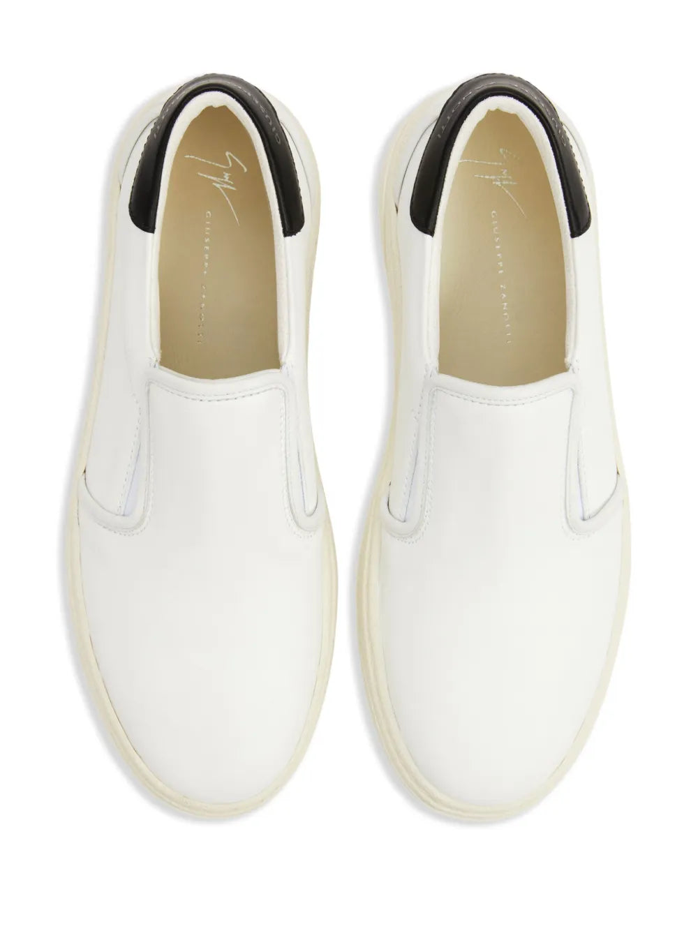 Off-white leather slip-on sneakers with padded collar and black side accents