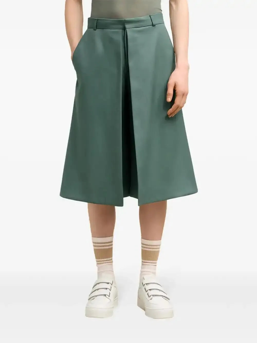 Green midi skirt with front pleats, side slit, and centered button closure