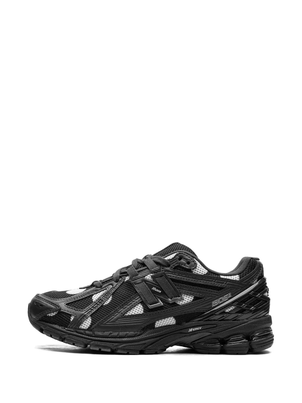 New Balance 1906R sneaker, front view: black mesh with white polka-dot details, lace-up