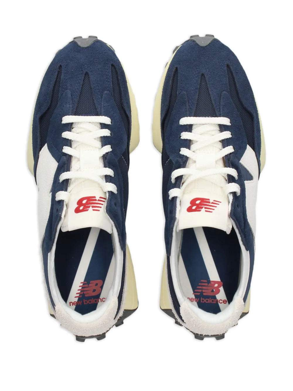 Pair of navy low-top sneakers with white laces, cream toe panels, red New Balance logo