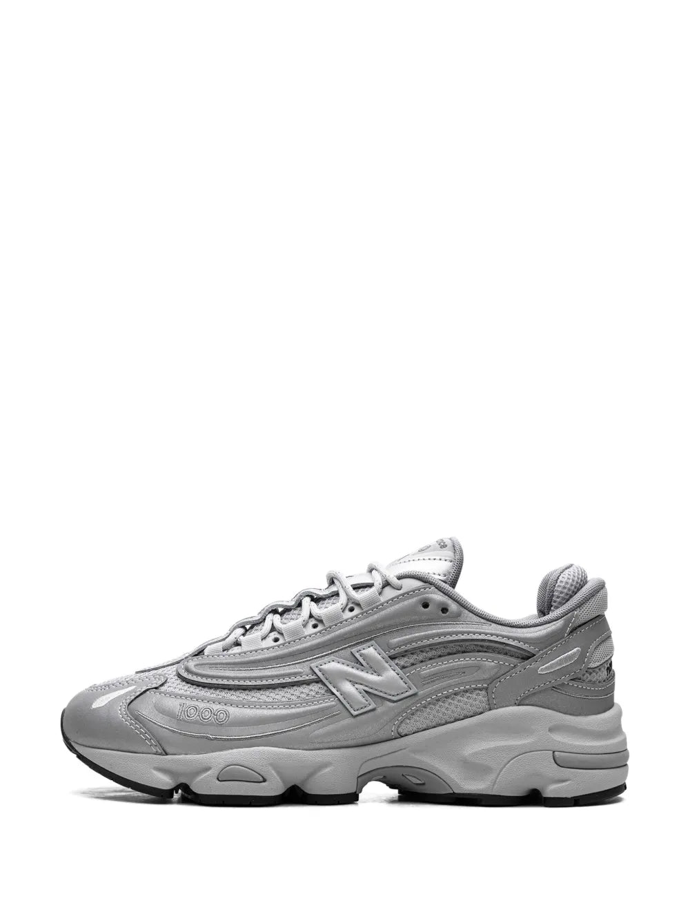 New Balance 1000 reflective sneakers, silver-tone front 3/4 view with lace-up upper
