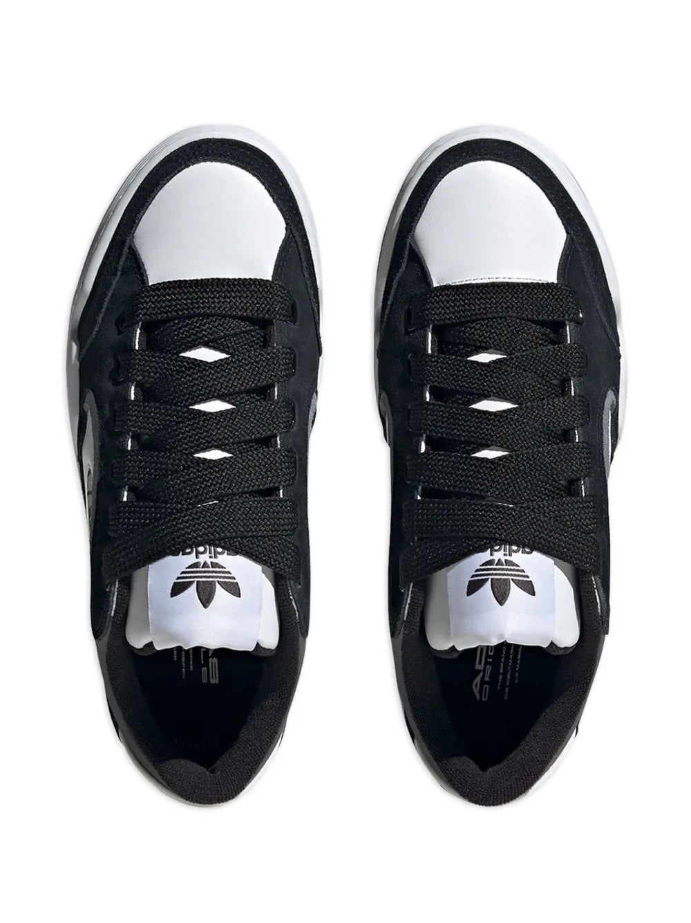 Black adidas low-top sneakers, lace-up design with white tongue logo