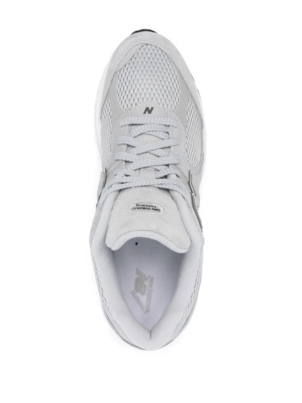 New Balance M2002W sneakers light grey, front top view, mesh toe and lace-up