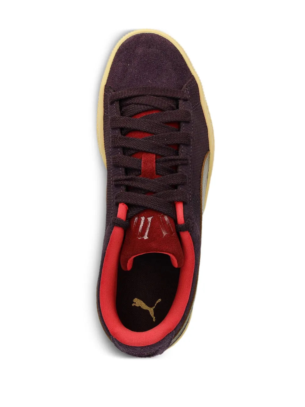 PUMA Play Loud sneakers with dark purple uppers, red laces, and gold sole