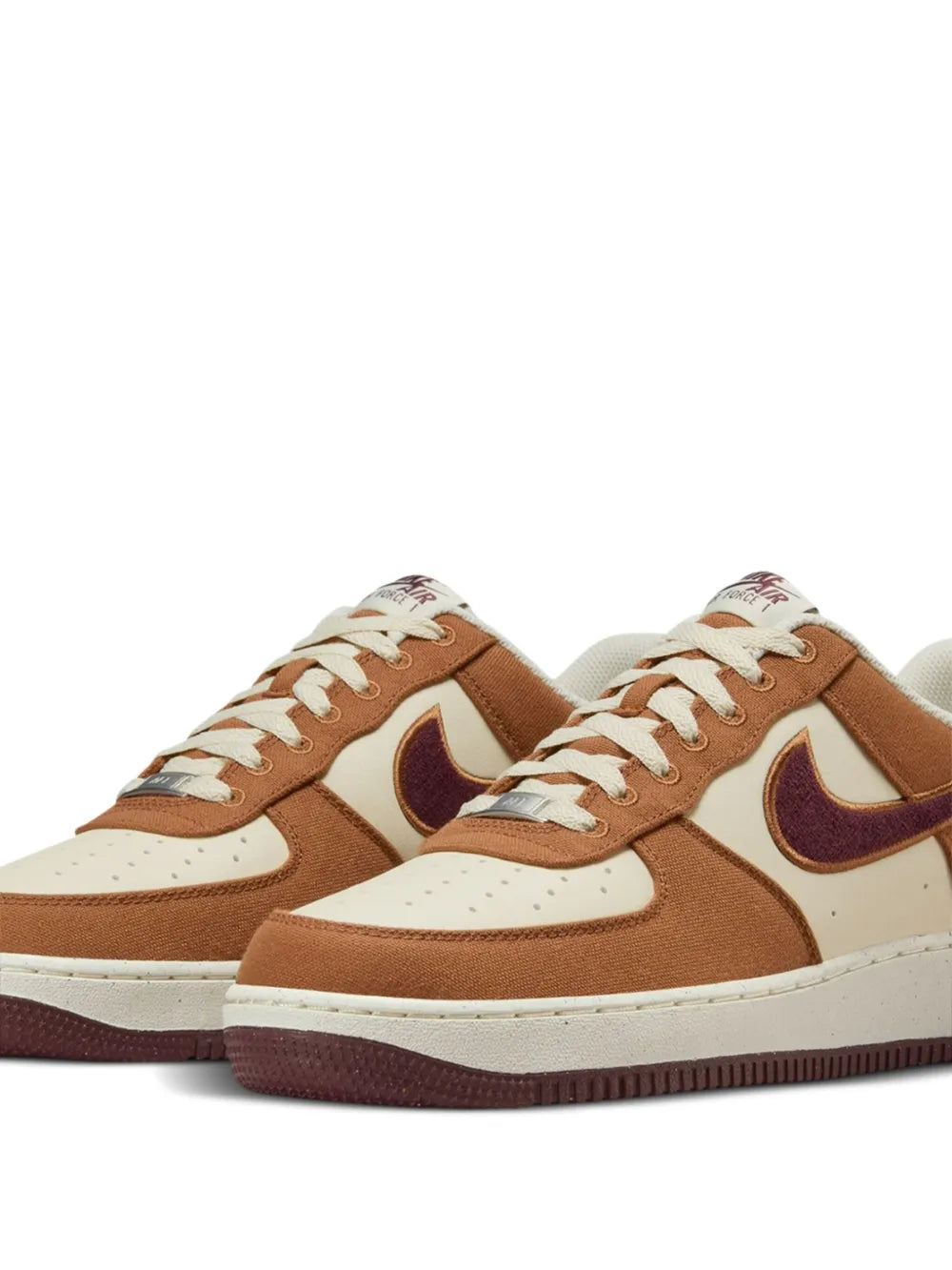 Nike Air Force 1 low sneakers, tan and white panels with burgundy swoosh, lace-up