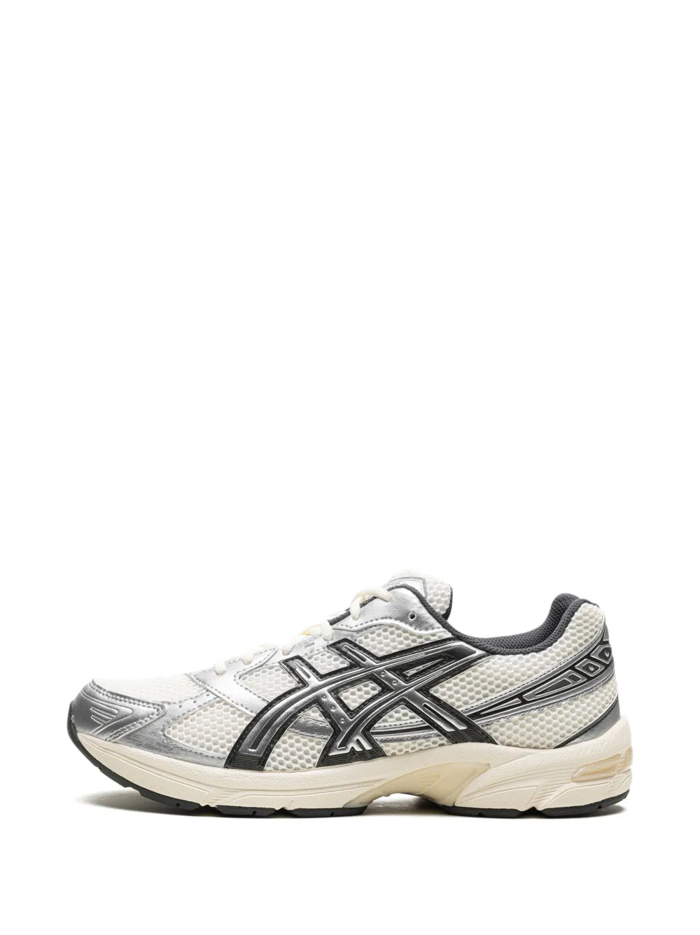 Cream white sneaker with black and silver side stripes and lace-up closure