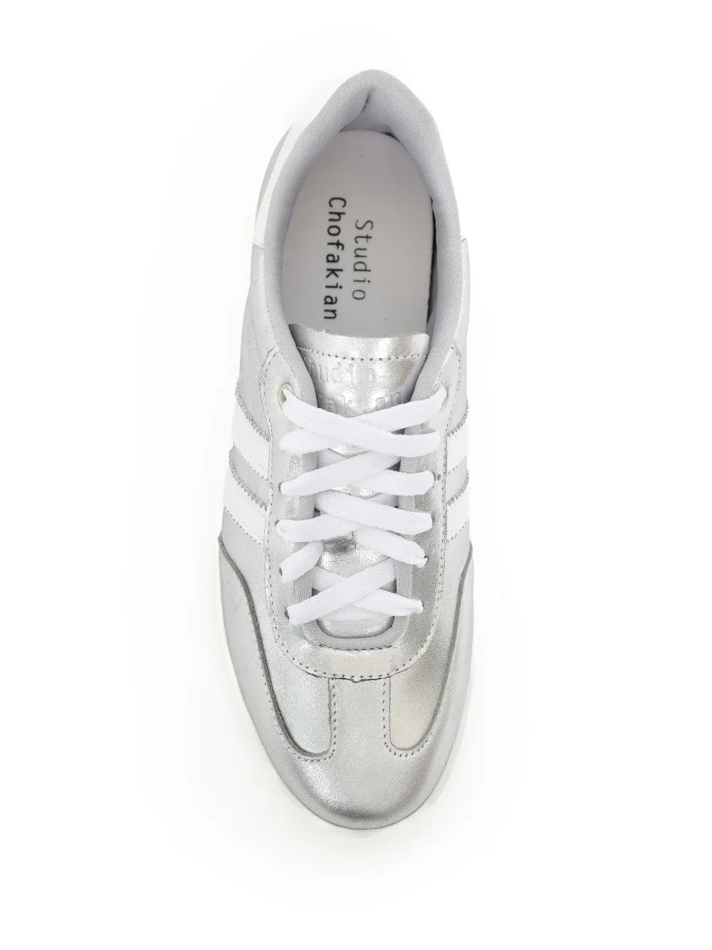 White and metallic silver lace-up sneakers with gray-lined interior