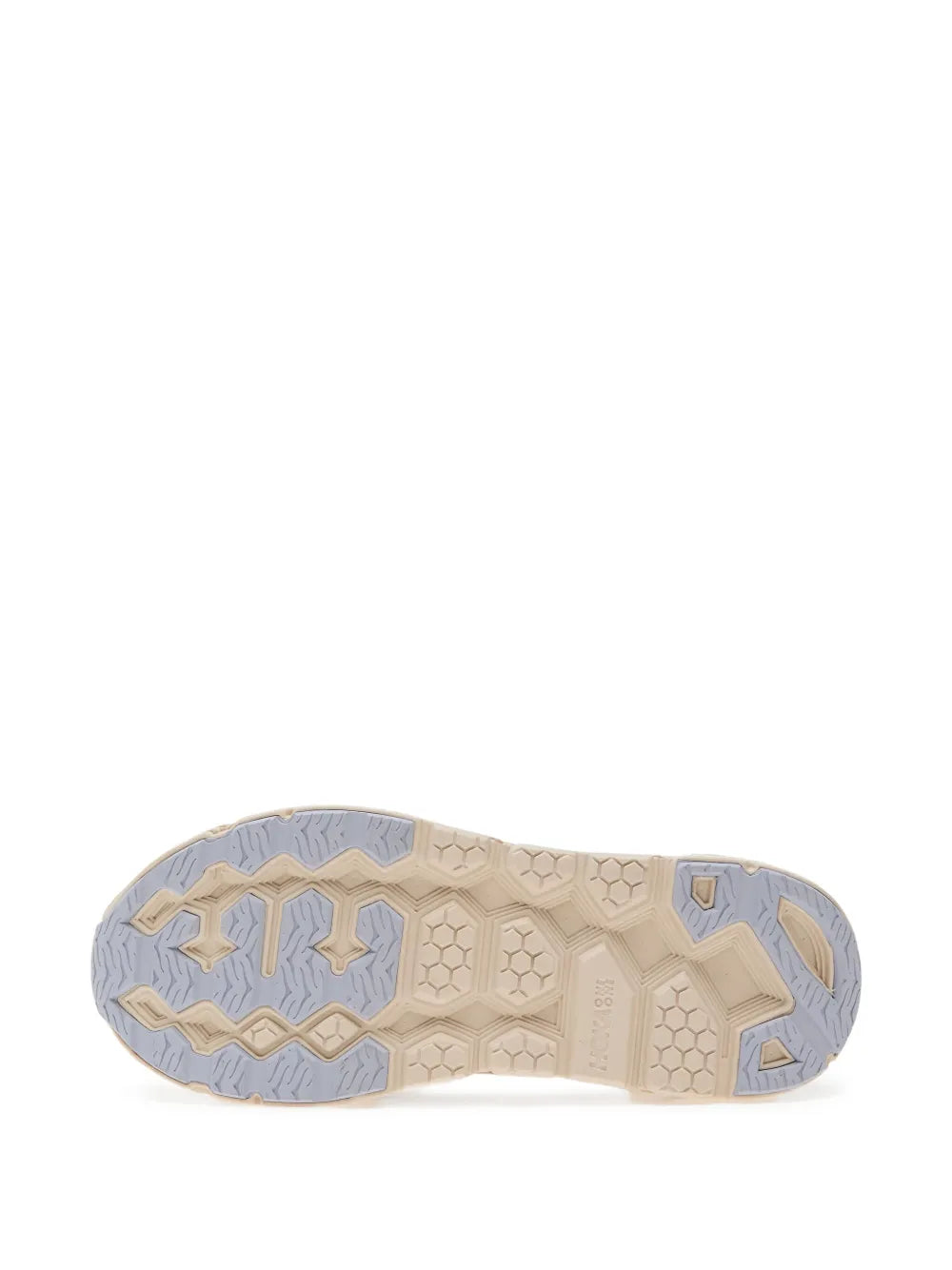 Beige suede running shoe outsole with textured tread and blue rubber sections.