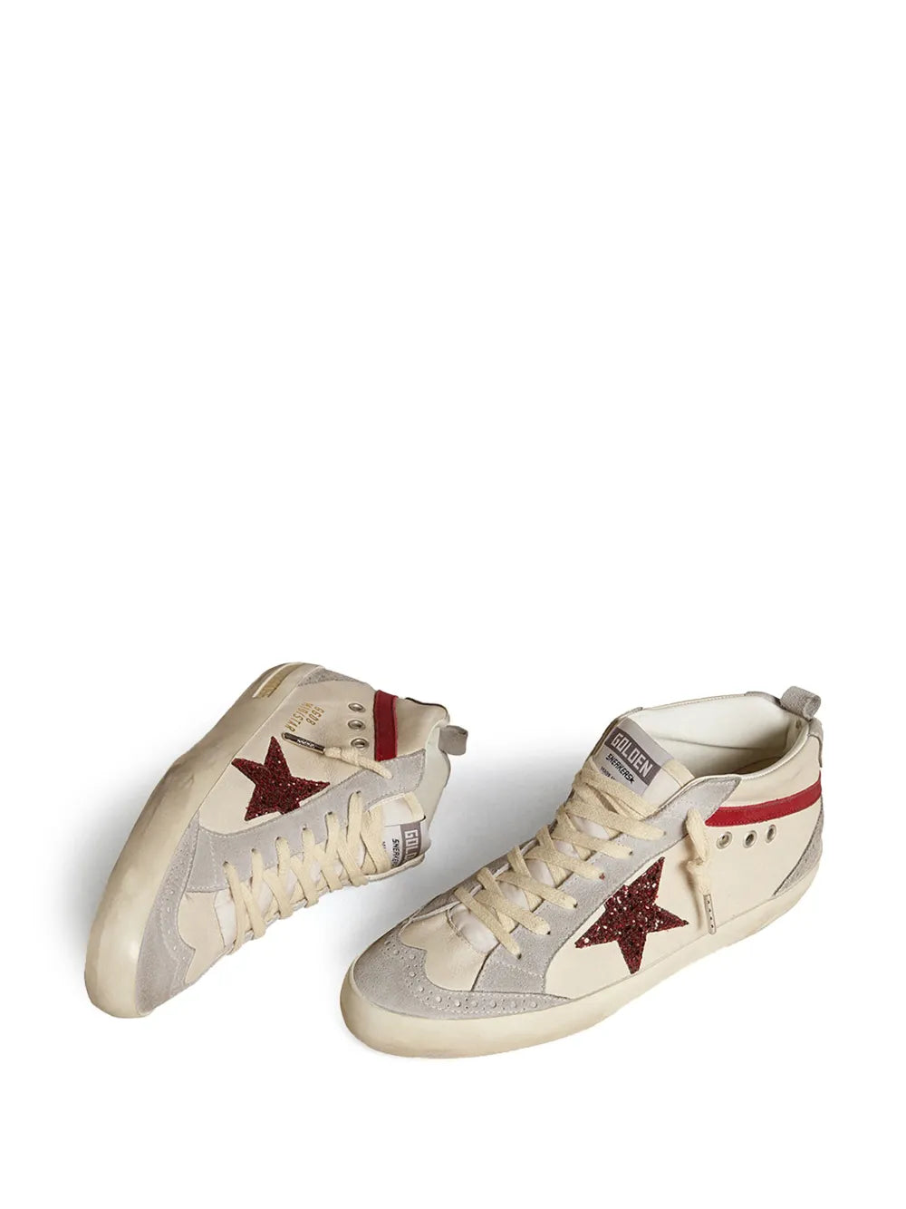 Pair of beige mid-top sneakers with red glitter star, padded collar, and white laces