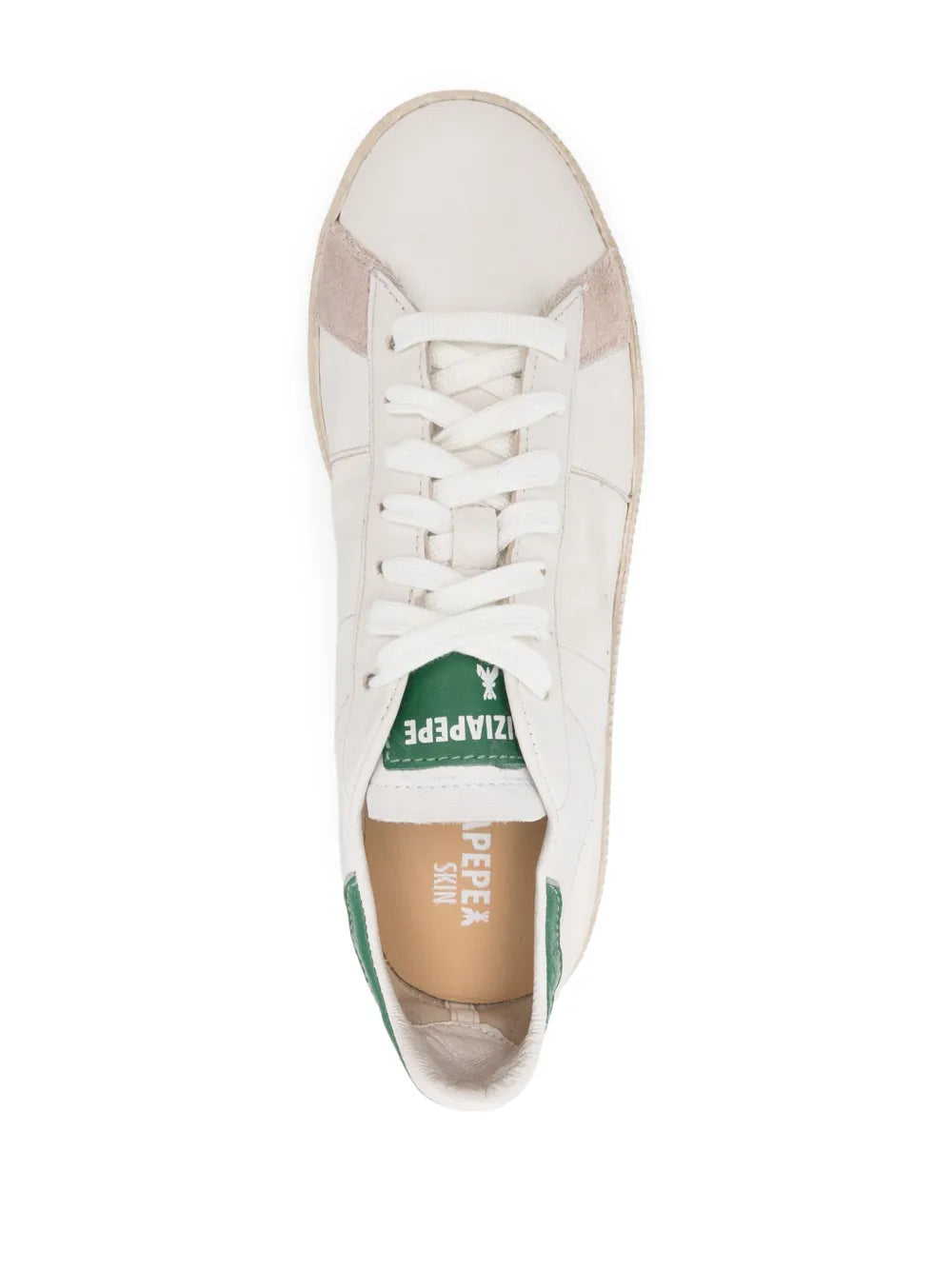 Top view of white low-top sneaker with green insole lettering and white laces