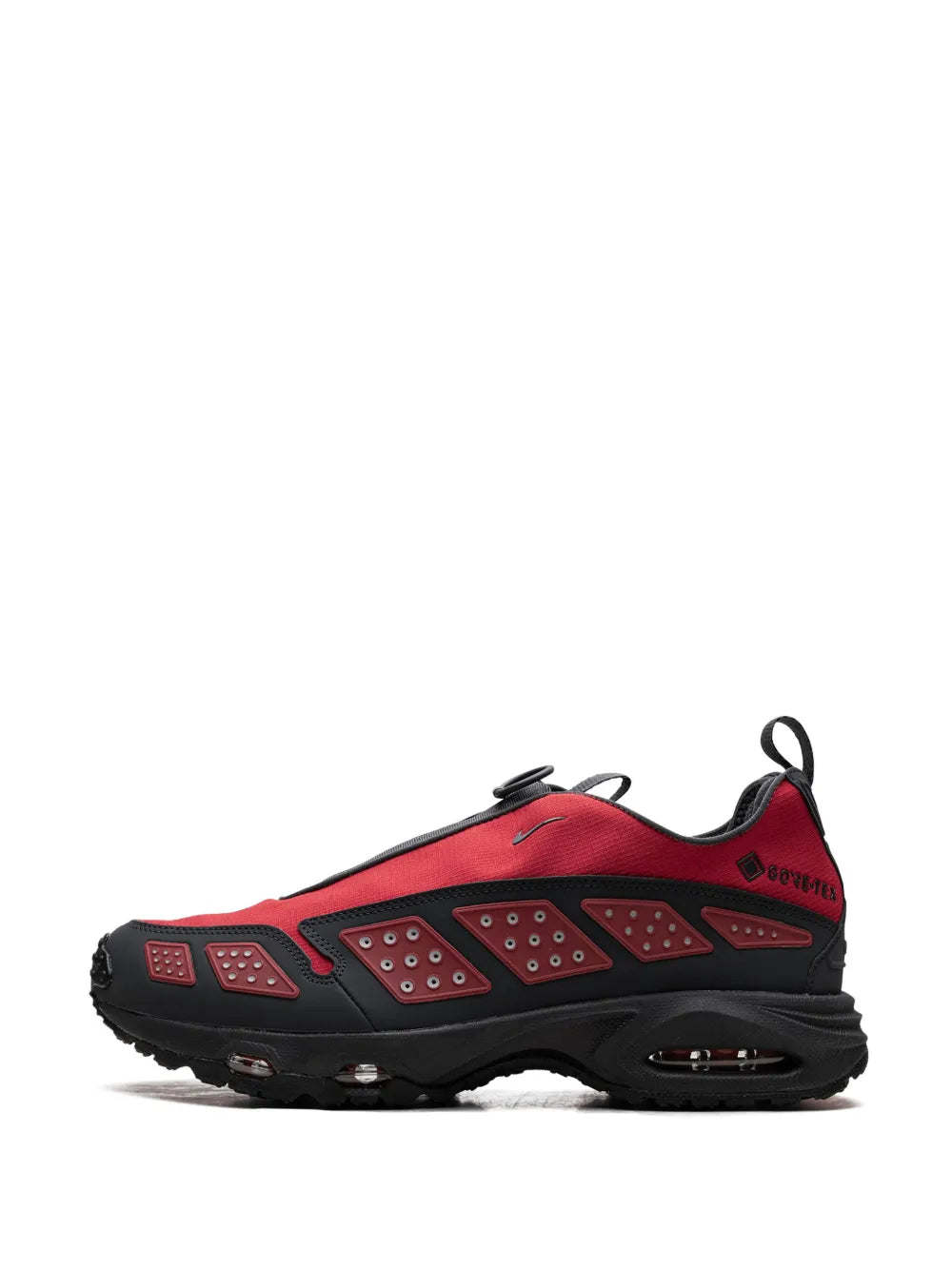 Red and black Gore-Tex sneaker, side/front view with lace-up eyelets