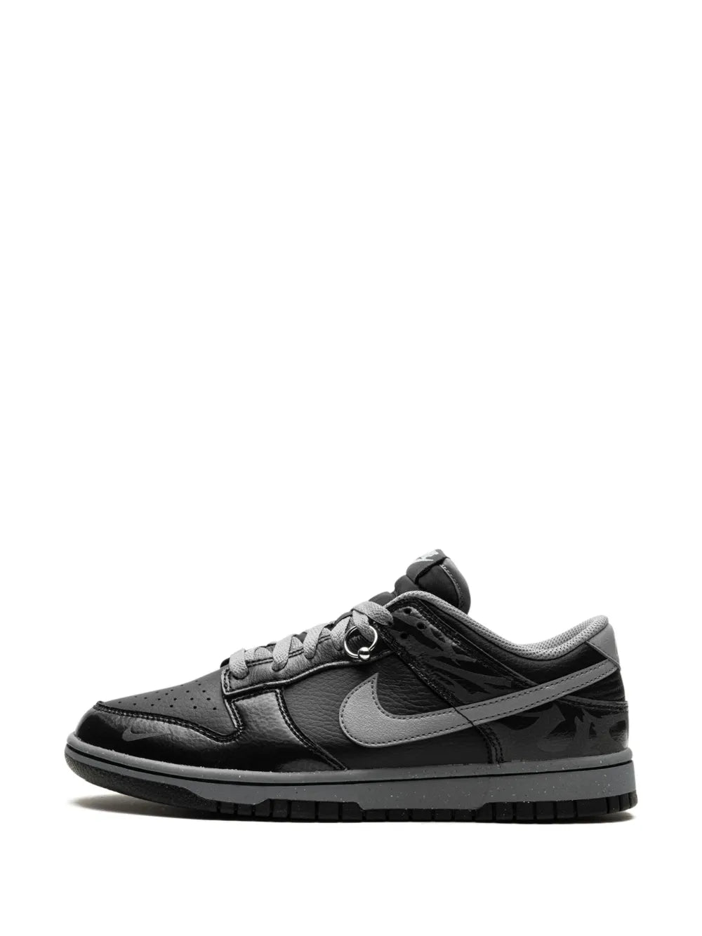 Nike black low-top sneakers with gray Swoosh and lace-up vamp